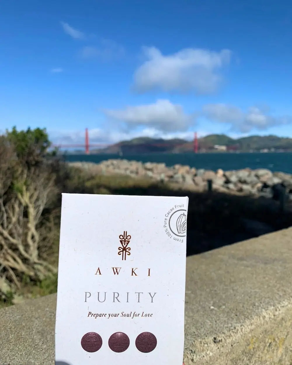 Awki Purity chocolate bar photographed in front of the Golden Gate Bridge in San Francisco