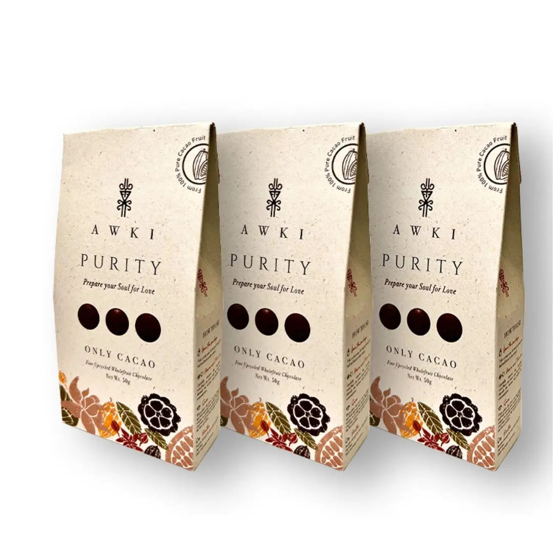 Three Awki Purity 50g cacao packs arranged upright with white background