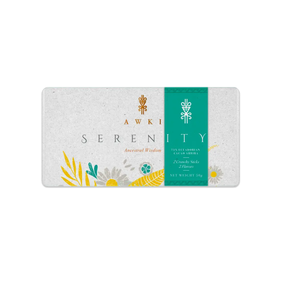 Awki SERENITY chocolate bar unwrapped next to open golden envelope and cacao beans