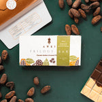 Awki Trilogy chocolate bar with cacao nibs and eco-conscious packaging, featuring three flavors of artisanal Andean chocolate on a green background