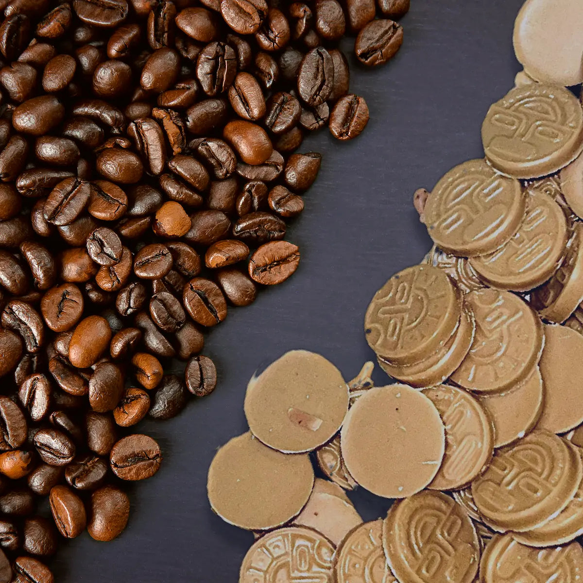 Flat lay of roasted coffee beans and AWKI white chocolate coins with coffee